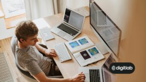 Mastering HubSpot - man sitting behind computer screens.