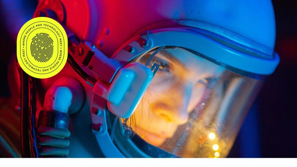 Close-up of a person wearing a futuristic helmet with vibrant blue and red lighting, accompanied by a bright yellow badge reading 'Where People and Technology Meet,' symbolizing the forward-thinking theme of 'INSIGHT 2025.'"